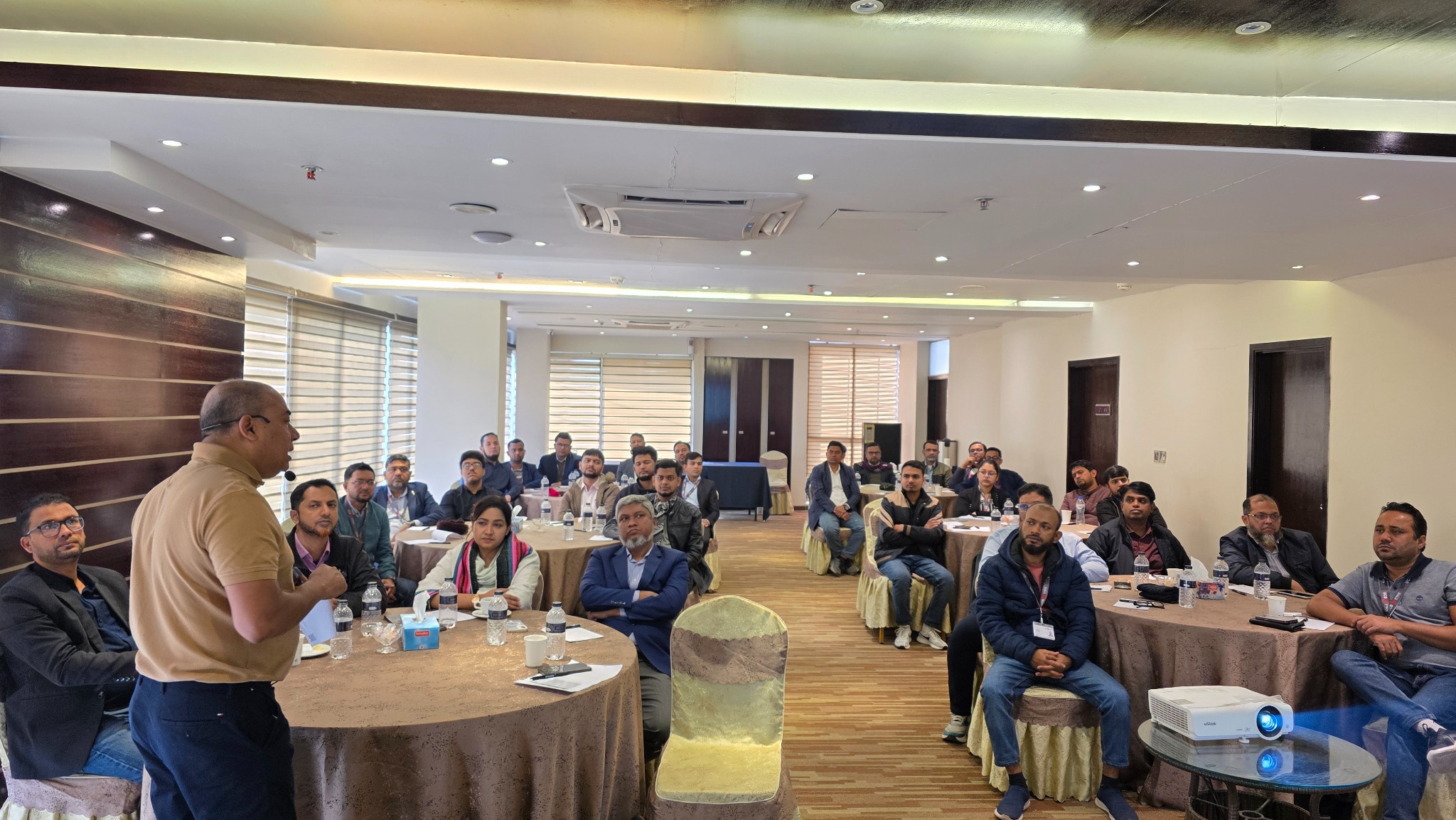 Participants attending a training session led by Zia Hasan